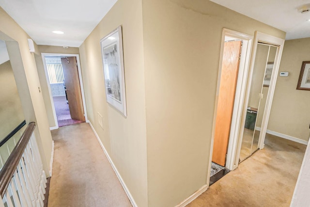 12 Grand Canyon Ln, Coram, NY 11727 - corridor featuring light carpet, an upstairs landing, and baseboards