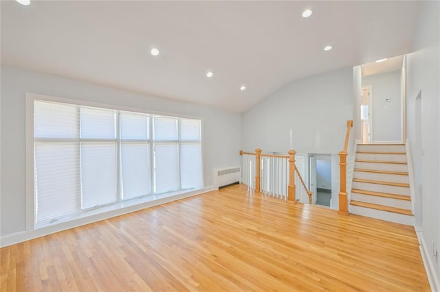 1841A Decatur Ave, Bellmore, NY 11710 - unfurnished room featuring radiator, lofted ceiling, light wood-style floors, recessed lighting, and baseboards