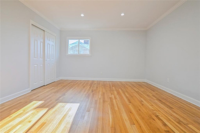 1841A Decatur Ave, Bellmore, NY 11710 - unfurnished bedroom with ornamental molding, light wood-style flooring, a closet, baseboards, and recessed lighting