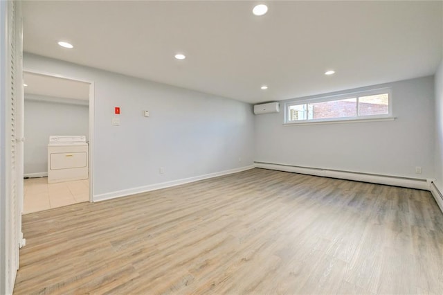 1841A Decatur Ave, Bellmore, NY 11710 - unfurnished room with washer / dryer, an AC wall unit, light wood finished floors, and recessed lighting