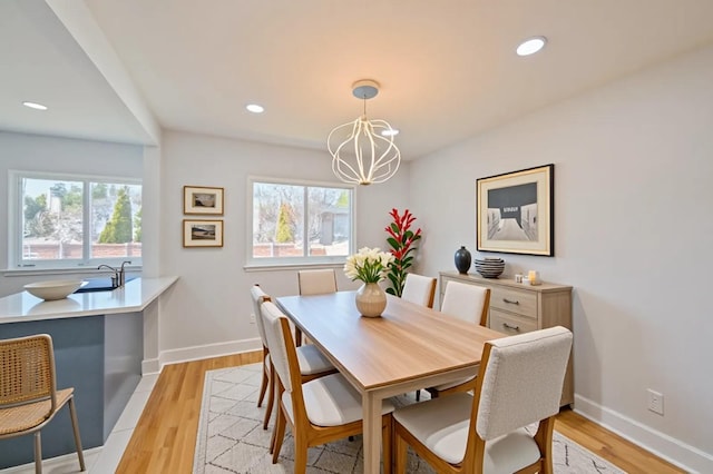 1841A Decatur Ave, Bellmore, NY 11710 - dining area featuring a chandelier, light wood-style flooring, baseboards, and recessed lighting