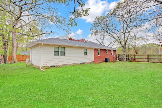 97 Overlook Dr, Mastic Beach, NY 11951 - back of property with central AC unit, a shingled roof, and crawl space