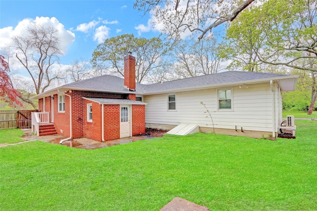 97 Overlook Dr, Mastic Beach, NY 11951 - rear view of property with a chimney and a shingled roof