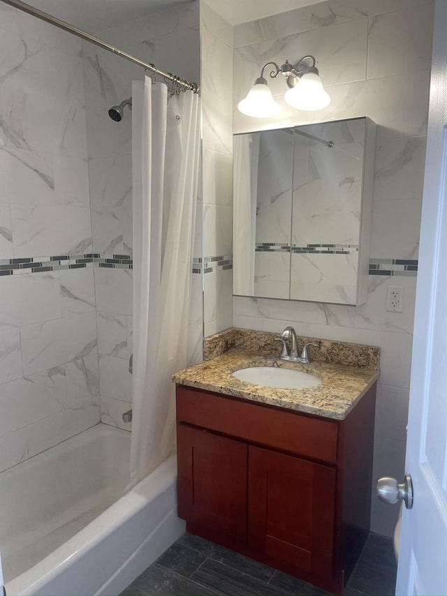 full bathroom with shower / tub combo and vanity