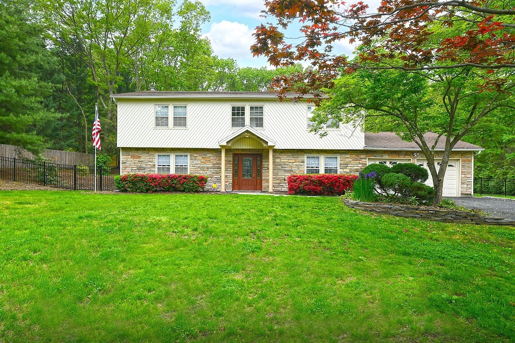 112 Stonehurst Ln, Dix Hills, NY 11746 - colonial inspired home with stone siding, asphalt driveway, and an attached garage