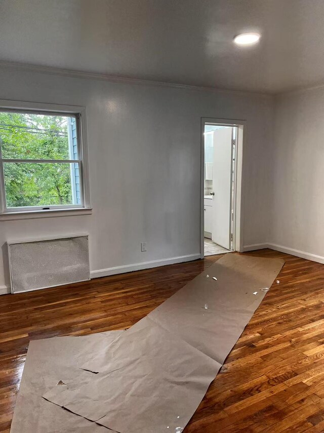 97 Hungry Harbor Rd, Valley Stream, NY 11581 - unfurnished room with wood finished floors, baseboards, and ornamental molding