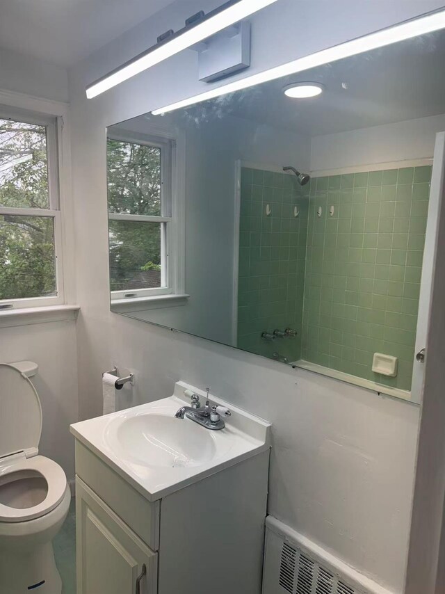 97 Hungry Harbor Rd, Valley Stream, NY 11581 - bathroom featuring a shower, vanity, and toilet