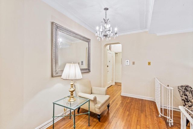 76-36 113th St Unit 1A, Forest Hills, NY 11375 - sitting room with arched walkways, hardwood / wood-style floors, baseboards, a chandelier, and ornamental molding
