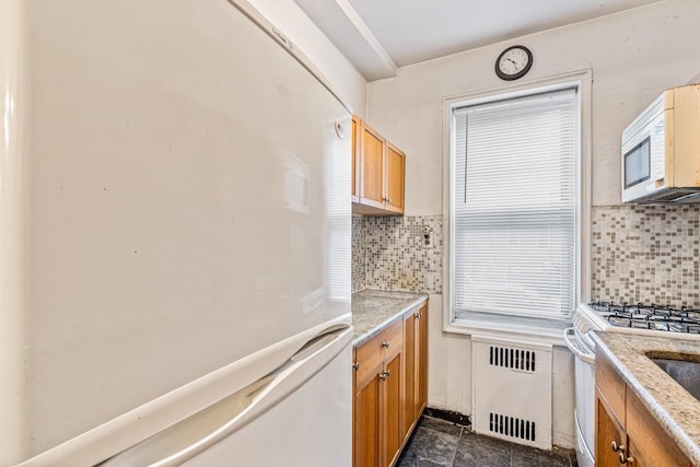 76-36 113th St Unit 1A, Forest Hills, NY 11375 - kitchen featuring white appliances, radiator heating unit, decorative backsplash, and brown cabinetry