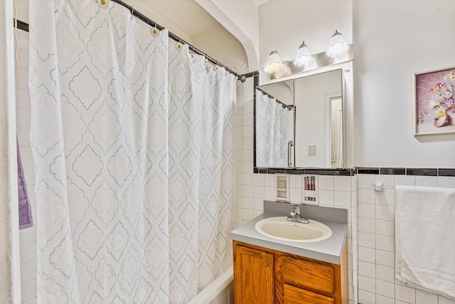 76-36 113th St Unit 1A, Forest Hills, NY 11375 - bathroom featuring tile walls, vanity, and a shower with curtain