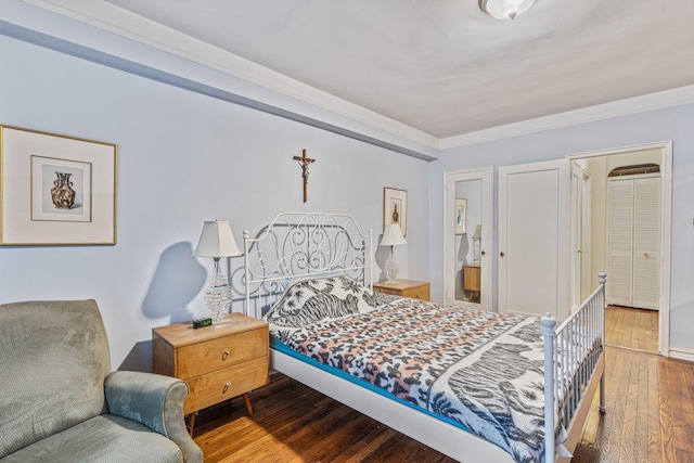 76-36 113th St Unit 1A, Forest Hills, NY 11375 - bedroom featuring hardwood / wood-style flooring, crown molding, and ensuite bath