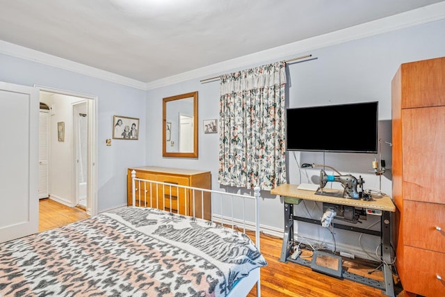 76-36 113th St Unit 1A, Forest Hills, NY 11375 - bedroom featuring wood finished floors, ornamental molding, and baseboards