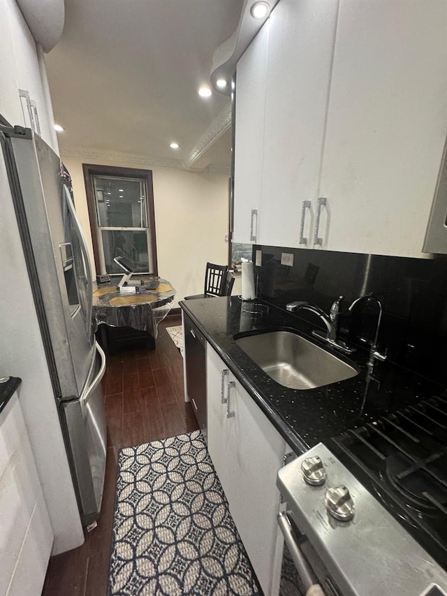 74-45 Yellowstone Blvd Unit 2A, Forest Hills, NY 11375 - kitchen featuring stainless steel fridge, a sink, white cabinetry, dark wood finished floors, and recessed lighting