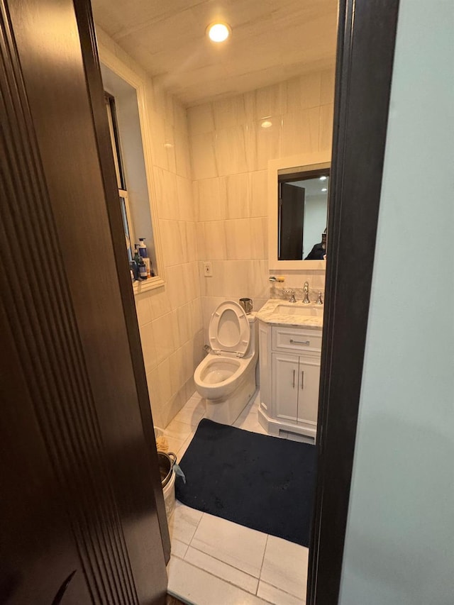 74-45 Yellowstone Blvd Unit 2A, Forest Hills, NY 11375 - bathroom with tile patterned floors, toilet, tile walls, vanity, and recessed lighting