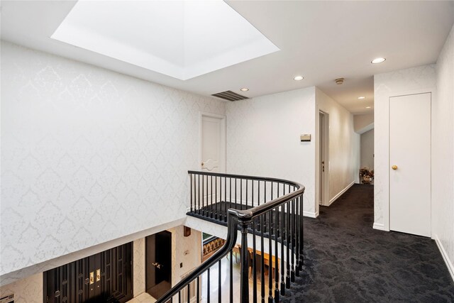 2 Harbor Ct W, Roslyn Harbor, NY 11576 - hall with an upstairs landing, dark colored carpet, baseboards, and recessed lighting