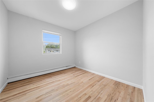 40 S 29th St, Wyandanch, NY 11798 - empty room with a baseboard radiator, wood finished floors, and baseboards