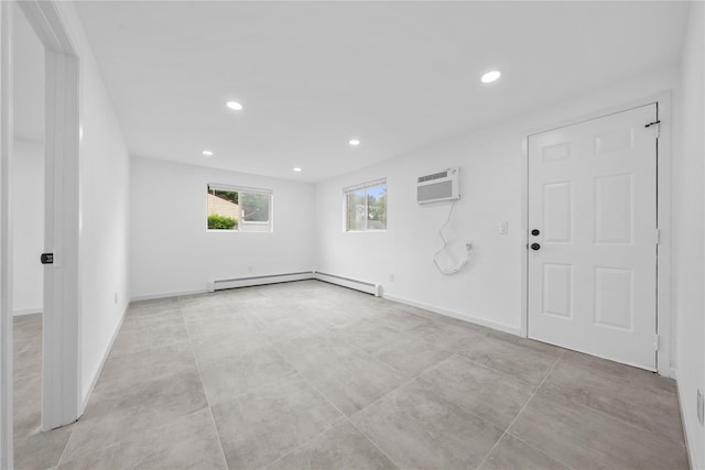 40 S 29th St, Wyandanch, NY 11798 - spare room with an AC wall unit, baseboard heating, recessed lighting, and baseboards