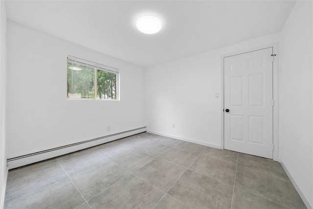 40 S 29th St, Wyandanch, NY 11798 - unfurnished room with a baseboard heating unit and baseboards