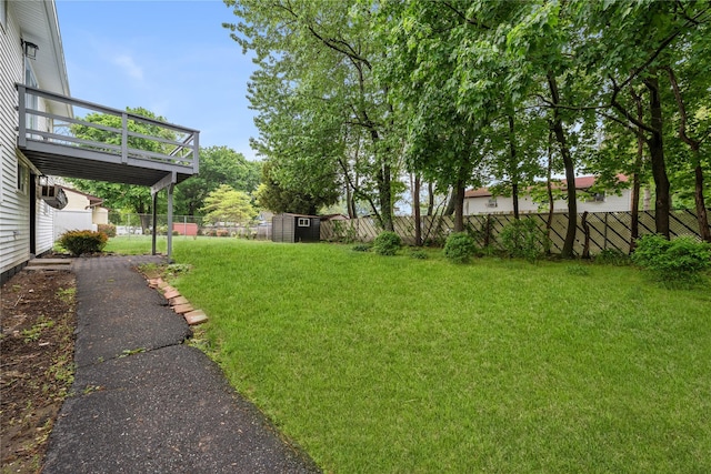 40 S 29th St, Wyandanch, NY 11798 - view of yard featuring a storage unit, an outbuilding, and a deck