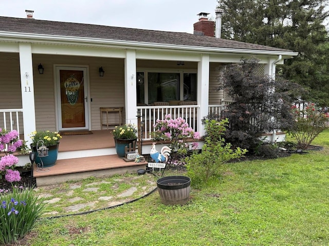 11 Queen Anne Ln, Wappingers Falls, NY 12590 - property entrance featuring a porch, a chimney, and a yard