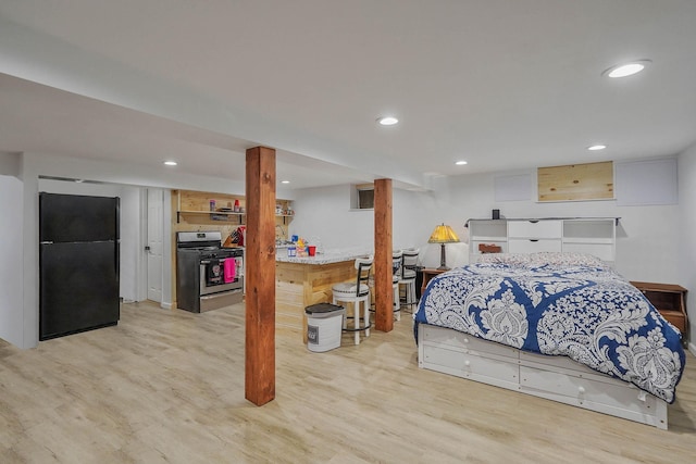 121 Tyler Ave, Miller Place, NY 11764 - bedroom featuring freestanding refrigerator, light wood-style floors, and recessed lighting