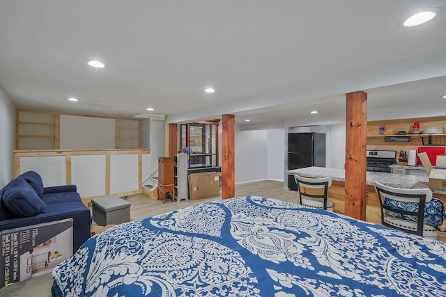 121 Tyler Ave, Miller Place, NY 11764 - bedroom with freestanding refrigerator, recessed lighting, and light wood-style flooring