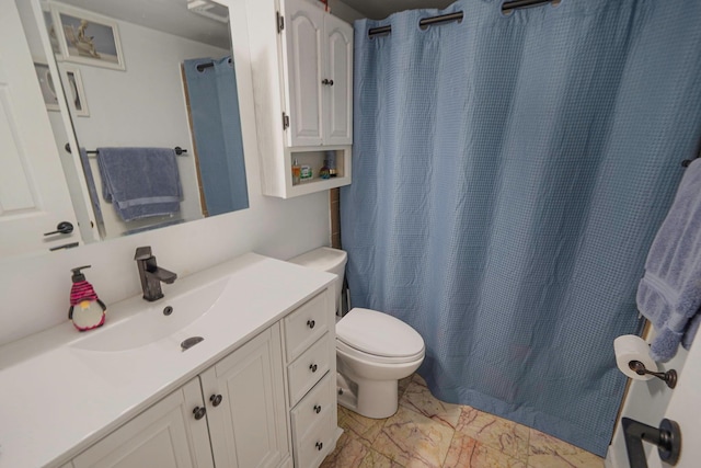 121 Tyler Ave, Miller Place, NY 11764 - full bath with marble look tile flooring, toilet, vanity, and curtained shower