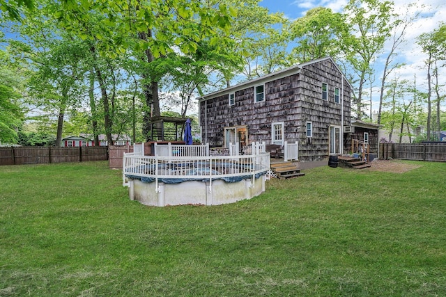 121 Tyler Ave, Miller Place, NY 11764 - rear view of house with a wooden deck