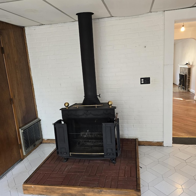 78-10 222nd St, Oakland Gardens, NY 11364 - detailed view of a wood stove and brick wall