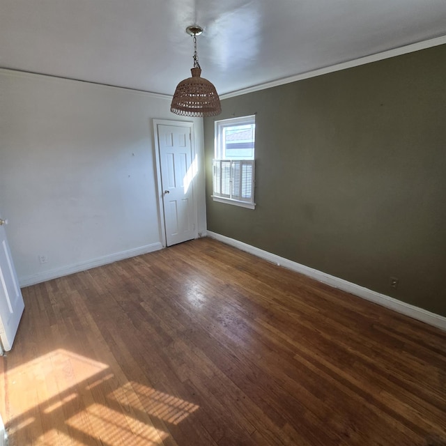 78-10 222nd St, Oakland Gardens, NY 11364 - unfurnished dining area featuring crown molding, wood finished floors, and baseboards