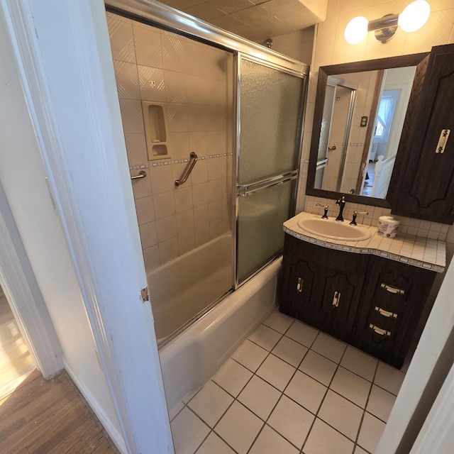 78-10 222nd St, Oakland Gardens, NY 11364 - full bath featuring vanity, combined bath / shower with glass door, and tile patterned floors