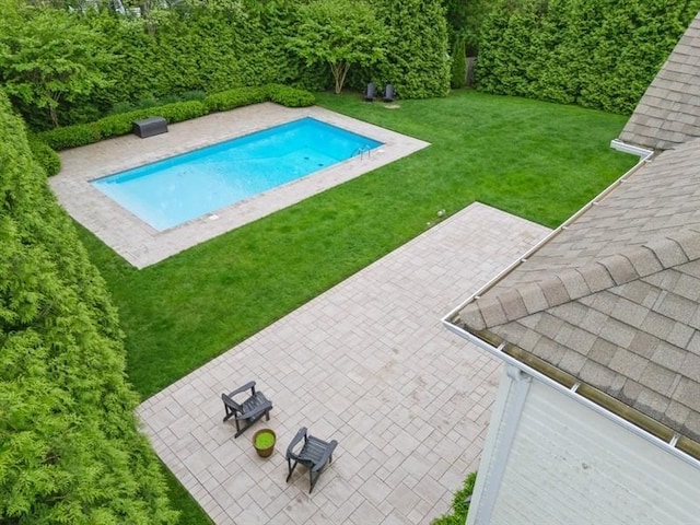 38 Savanna Cir, Mount Sinai, NY 11766 - swimming pool featuring a patio and a lawn