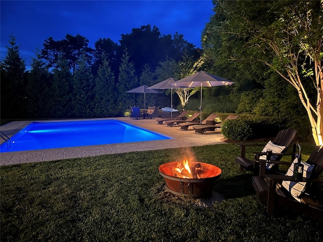 38 Savanna Cir, Mount Sinai, NY 11766 - pool at twilight with an outdoor fire pit, an outdoor pool, a yard, and a patio