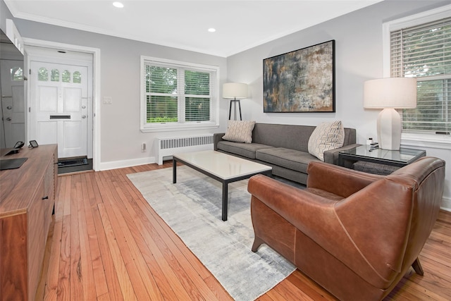 4 Peck Unit 47A, Rye, NY 10580 - living room with radiator heating unit, light wood-style floors, crown molding, baseboards, and recessed lighting