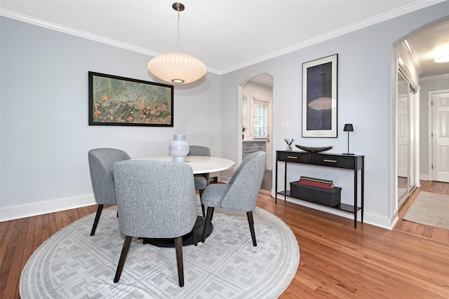 4 Peck Unit 47A, Rye, NY 10580 - dining space featuring arched walkways, light wood-type flooring, ornamental molding, and baseboards