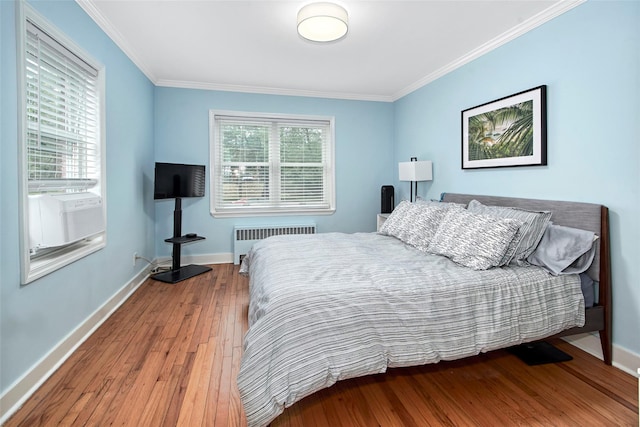 4 Peck Unit 47A, Rye, NY 10580 - bedroom with radiator heating unit, wood-type flooring, crown molding, and baseboards