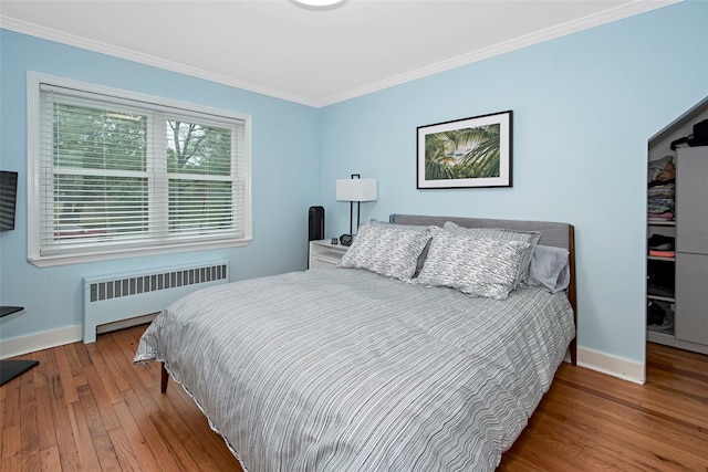 4 Peck Unit 47A, Rye, NY 10580 - bedroom featuring radiator heating unit, ornamental molding, baseboards, and hardwood / wood-style floors