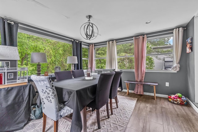 209 Laurel Dr, Cortlandt Manor, NY 10567 - dining space featuring wood finished floors, baseboards, and a chandelier