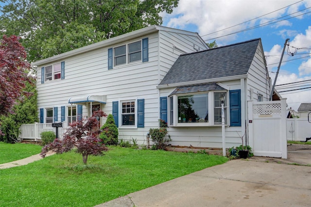 31 Clover Ln, Levittown, NY 11756 - view of front of home with a shingled roof