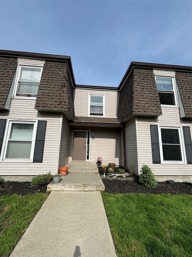 150 Rinaldi Blvd Unit 1C, Poughkeepsie, NY 12601 - view of front facade featuring roof with shingles, mansard roof, and a front lawn