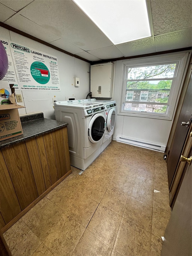 150 Rinaldi Blvd Unit 1C, Poughkeepsie, NY 12601 - clothes washing area featuring washing machine and clothes dryer, a baseboard heating unit, cabinet space, and light tile patterned flooring