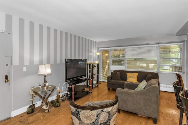 12427 Flatlands Ave Unit 1A, Brooklyn, NY 11208 - living area featuring wood finished floors, baseboards, a baseboard heating unit, and wallpapered walls