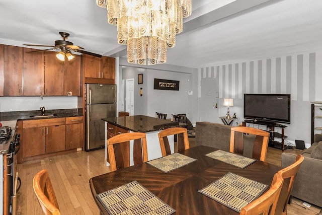 12427 Flatlands Ave Unit 1A, Brooklyn, NY 11208 - dining room featuring a ceiling fan, light wood finished floors, and a chandelier