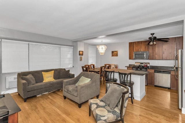12427 Flatlands Ave Unit 1A, Brooklyn, NY 11208 - living room featuring light wood finished floors, a chandelier, and a ceiling fan