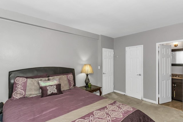 12427 Flatlands Ave Unit 1A, Brooklyn, NY 11208 - carpeted bedroom with baseboards, a sink, and ensuite bathroom