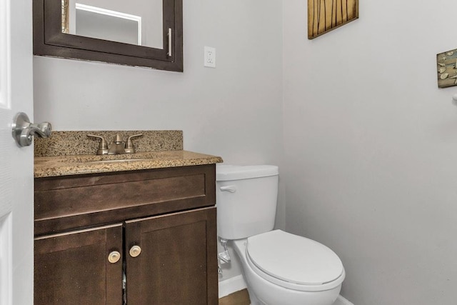 12427 Flatlands Ave Unit 1A, Brooklyn, NY 11208 - bathroom with baseboards, toilet, and vanity