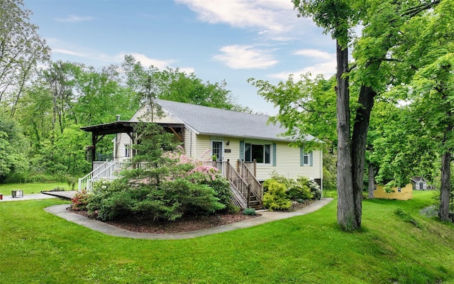 9 Chapel Rd, Newburgh, NY 12550 - view of front of property featuring stairway and a front yard