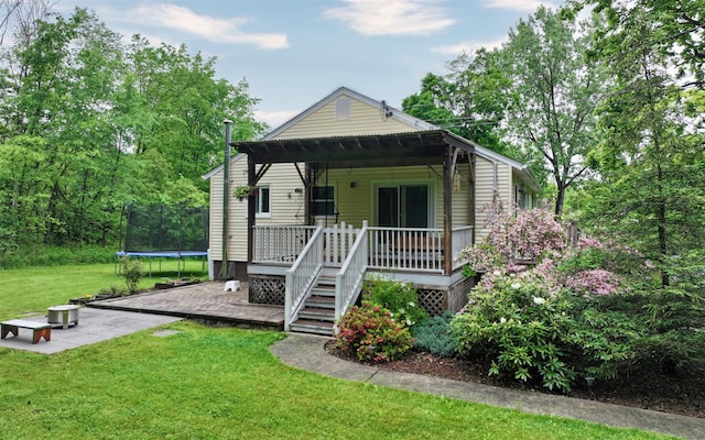 9 Chapel Rd, Newburgh, NY 12550 - view of front facade featuring a trampoline, a front lawn, and a patio area