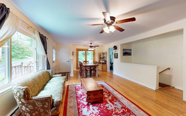 9 Chapel Rd, Newburgh, NY 12550 - living room featuring a baseboard radiator, a ceiling fan, light wood-style floors, and baseboards