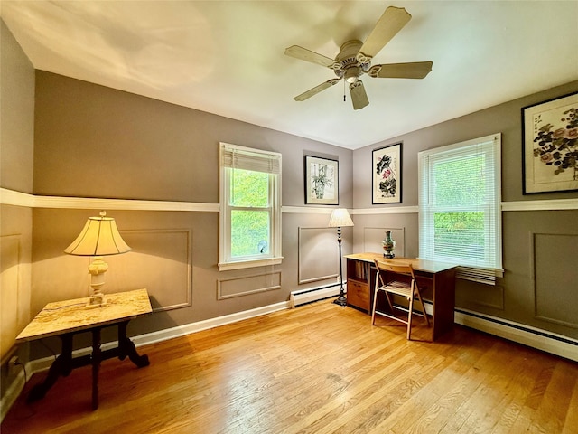 9 Chapel Rd, Newburgh, NY 12550 - office featuring a baseboard heating unit, wood finished floors, and ceiling fan
